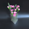 A set of 15 triangular connected tube vases